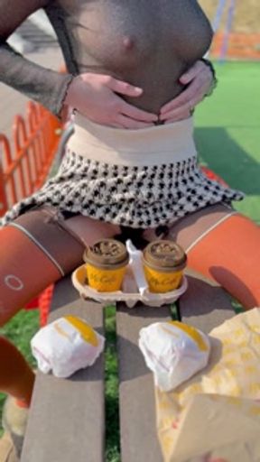 Naked drinking coffee in the park