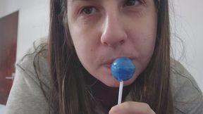 Chubby girl teases with her wet tongue while licking a big round lollipop slowly — close up mouthplay, tongue worship, drooling action, oral fetish