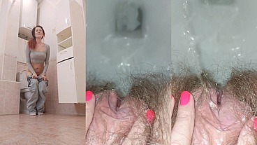 Pissing woman in the toilet