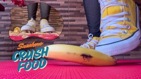 Goddess Lohan mashing a banana with her sneakers