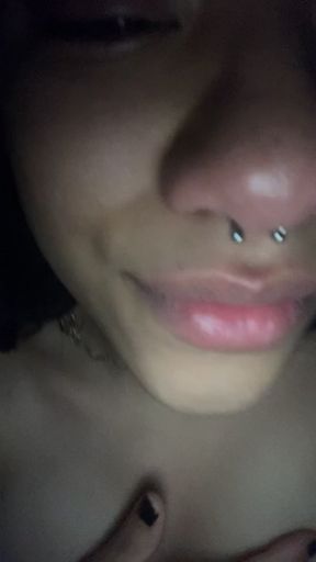 Close-up of a woman with nose piercing