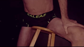 Grinding Up Close On Stool in Bicycle Shorts with Dark Background
