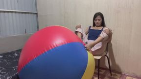 Deflating beach ball using feet