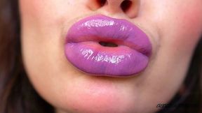 wet violet glossy kiss close up