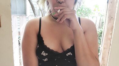 smoking a cigarette outside with my titties out