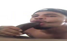 Latino sucks a huge black mushroom head cock