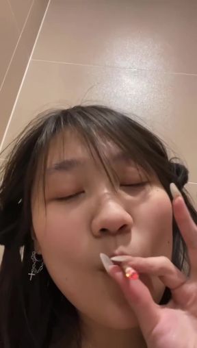 Chinese teen smoker shows off her slim figure