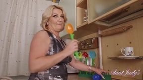 Linetta's Kitchen Tease: Busty 52-Year-Old MILF in Action!