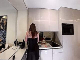 Hot sexy long legs brunette wife in black and red fishnet stockings with a satin nightie teases in the kitchen