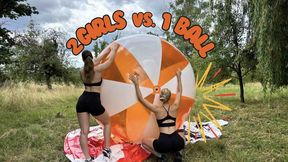 2 girls vs. 1 giant beach ball