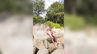 Draining off on the beach in thailand and nutting in the water. Public masturbate off