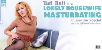 Tati Bali is a horny housewife that loves to play with her wet shaved pussy when she's alone