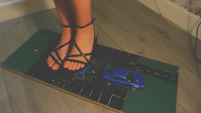 Giantess goddess WinnieLouxo Crushes a Subaru Impreza and a Nissan 300ZX in black block heels with painted toenails right close view