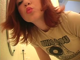 Check out this redhead teen cutie putting on makeup