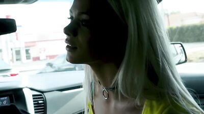 Petite blonde swallows a huge black dick in a car before fucking