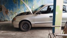 with her stiletto heels she pumping the pedals of her old car (3)