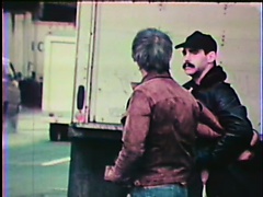 Vintage gay action as a crooked cop gives a civilian blowjob in living color