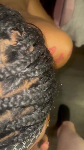Black woman with braided hair