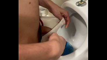 2 boys having fun at the pool public toilets'_ urinal