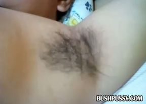 Dark haired hairy bitch shows closeup of armpits and bush