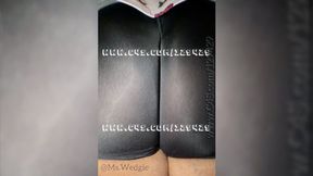 Jiggling her cheeks in spandex shorts