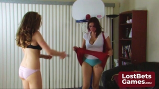 Two stunning girls engage in a playful strip game of Snip Basketball
