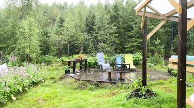 Soft summer rain makes love swell between dainty girls tangled up on wet grass