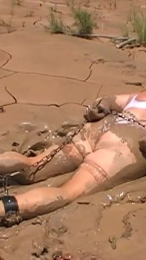 Julie Cunningham in Lingerie Wriggles Hard in Mud Hogtied with Chains. Sploshing Dirty Whore. Huge Tits Covered in Mud.