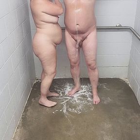 Husband and blonde wife showering