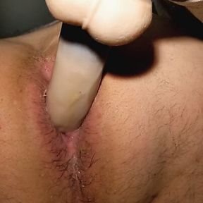 Horny bottom fucks his ass with one of his dildos