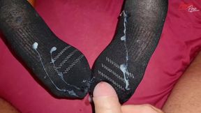 The stepmother put on black socks and made a sockjob for the stepson