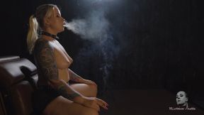Topless smoker in the dark room 4K MP4