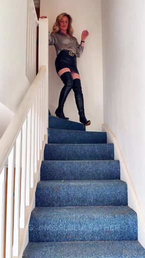 Woman in boots on staircase