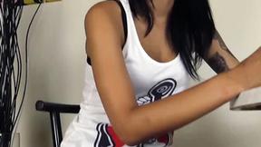 ”Brunette smokes a cigarette in black pantyhose & ballet flats”