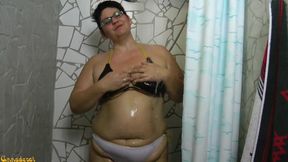 In bikini and jeans in d shower