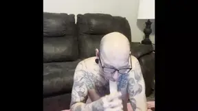 Tattooed Cuckold Sucks Dick