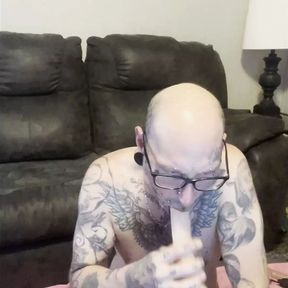 Tattooed Cuckold Sucks Dick