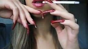 Sexy girl with extra long nails smoking seductively on webcam