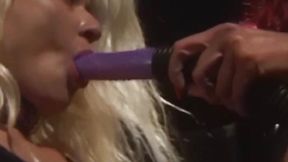 Redhead mistress toys with submissive lesbian using large dildo
