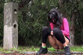 Lovely long haired brunette in black tights and pink top pisses on the read