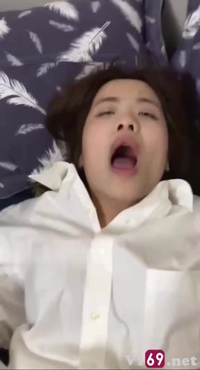 Asian Vietnamese Cutie masturbates with a toy