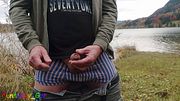 Pissing outdoor by a mountain lake, then I jerk off my shaved, foreskin cock.