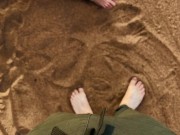 A man pissed on the feet of a guy who was relaxing on a public beach. Pissing in nature
