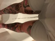 Tattooed guy wetting boxers