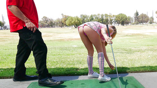 Karla Kush teasing her golf instructor with her short skirt