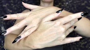 Graceful hands with long black nails will captivate your gaze