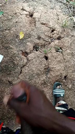 An African adult man masturbating inside the bush with his big dick