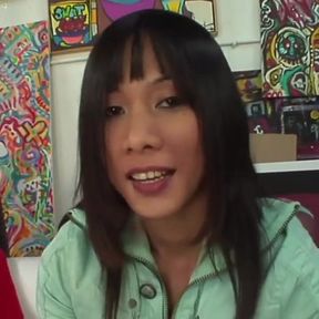 Asian slut rides a big solid cock on the sofa