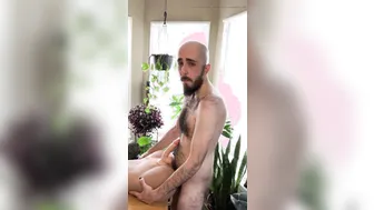 Hairy skinny bearded guy fucks sex doll on table and sucks dildo