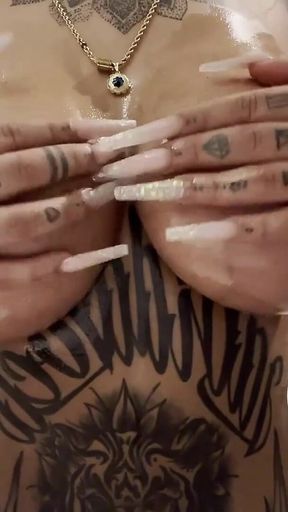 Tattooed MILF Tyra Shows Oiled Tits and Wet Pussy